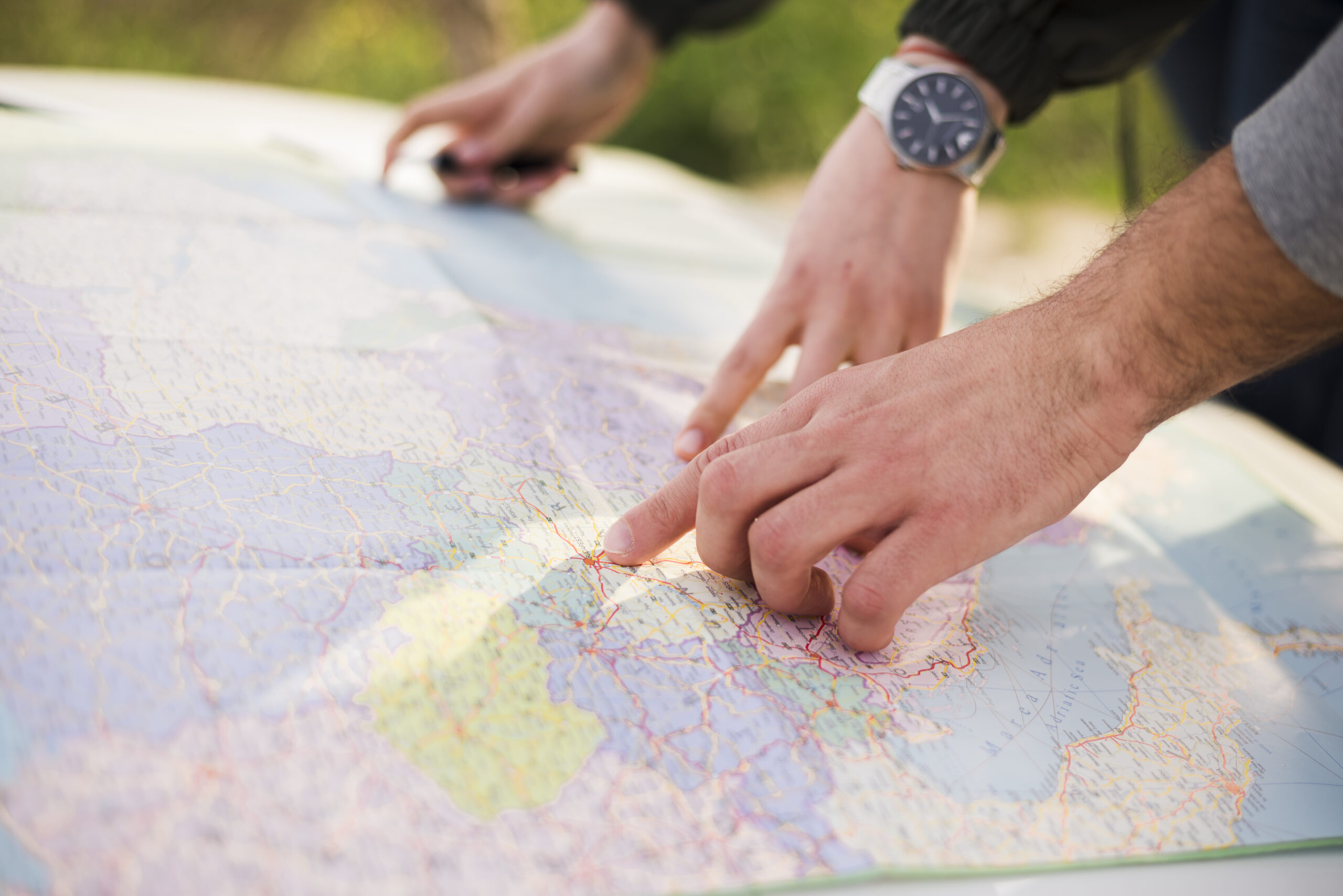 people-navigating-with-map-road-trip